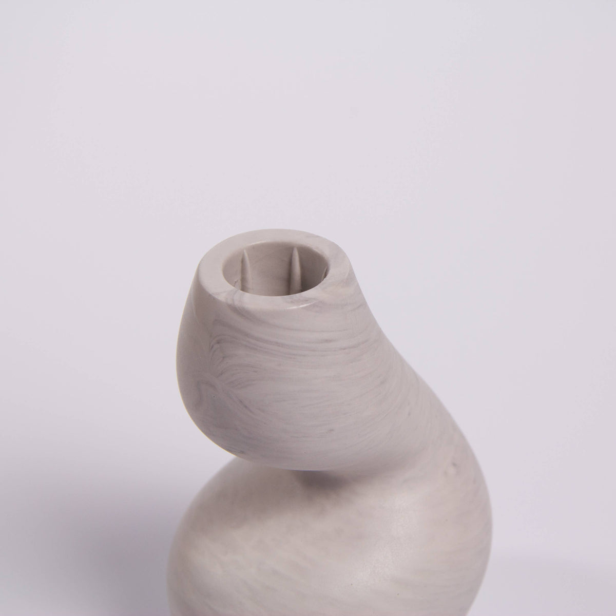 Gravity sculptural candle holder