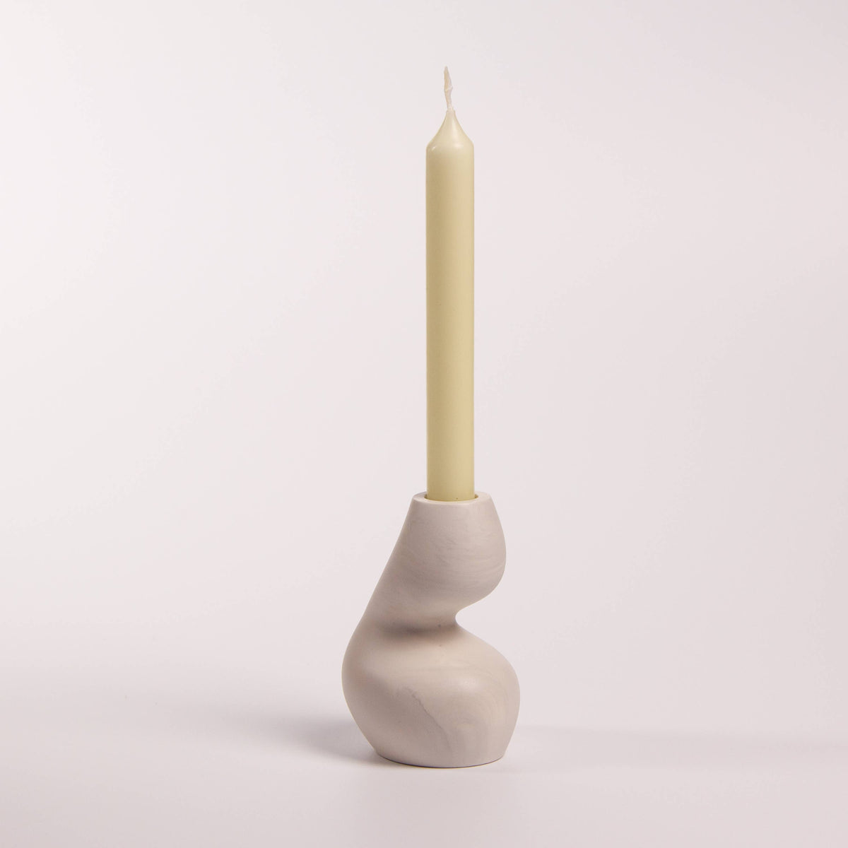 Gravity sculptural candle holder