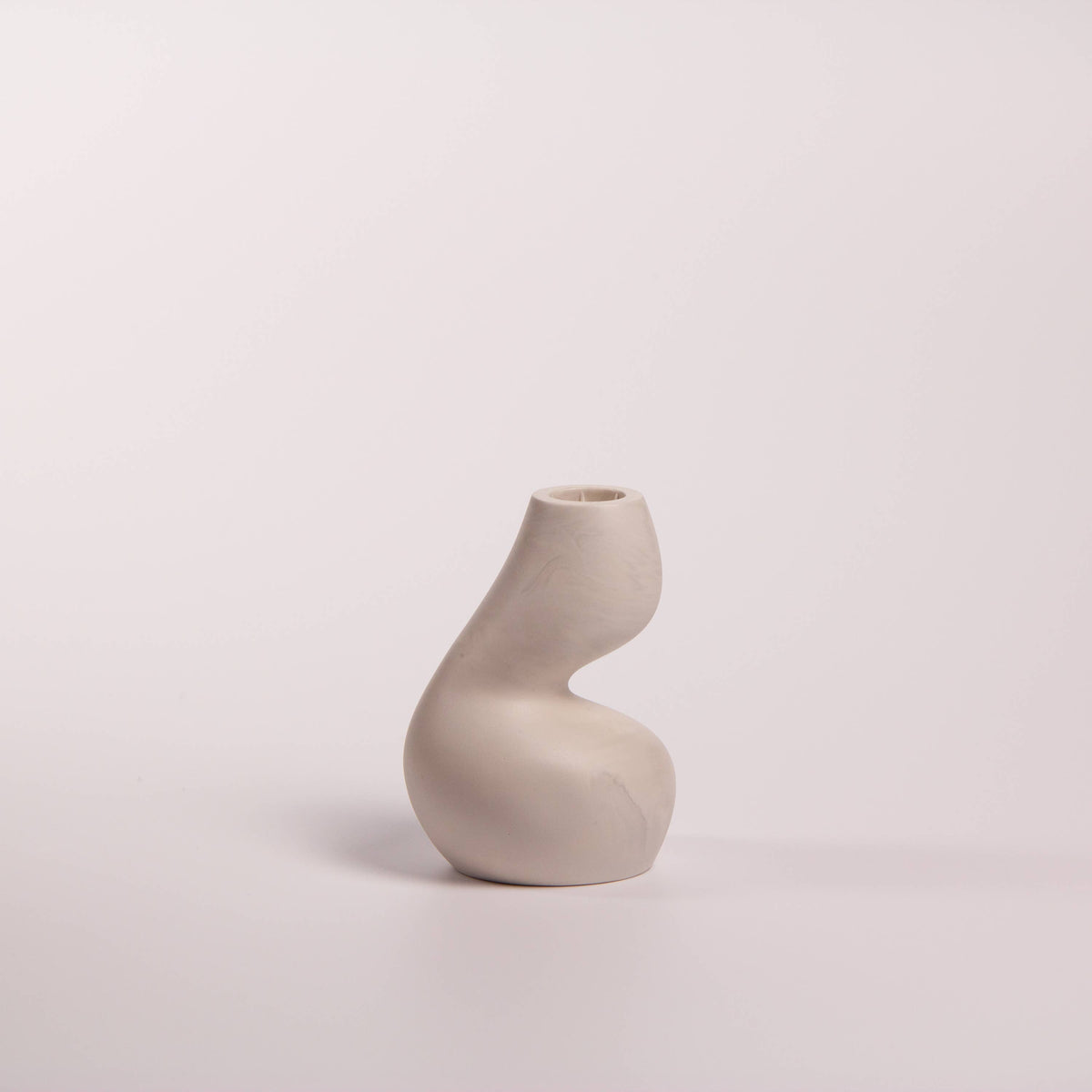 Gravity sculptural candle holder