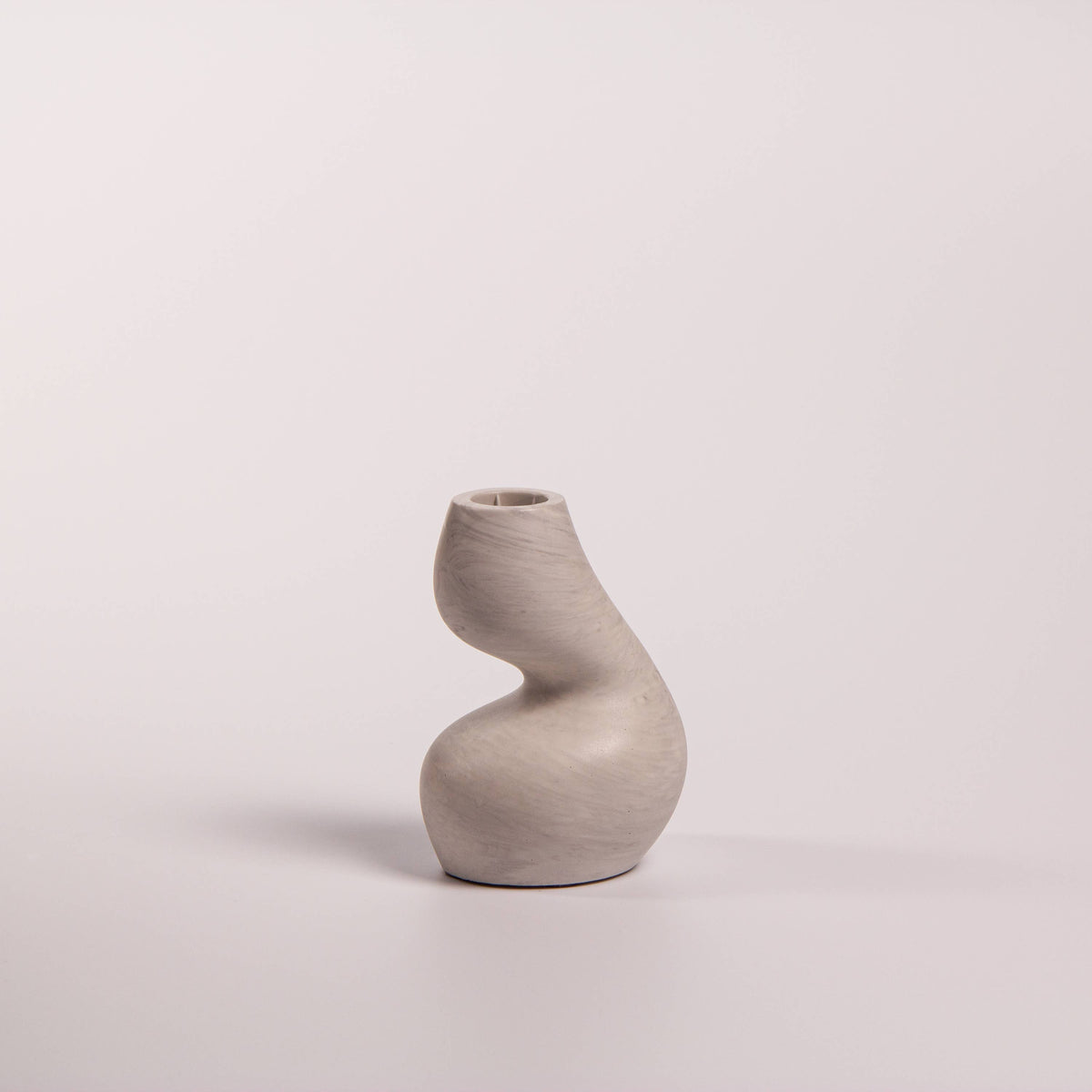 Gravity sculptural candle holder